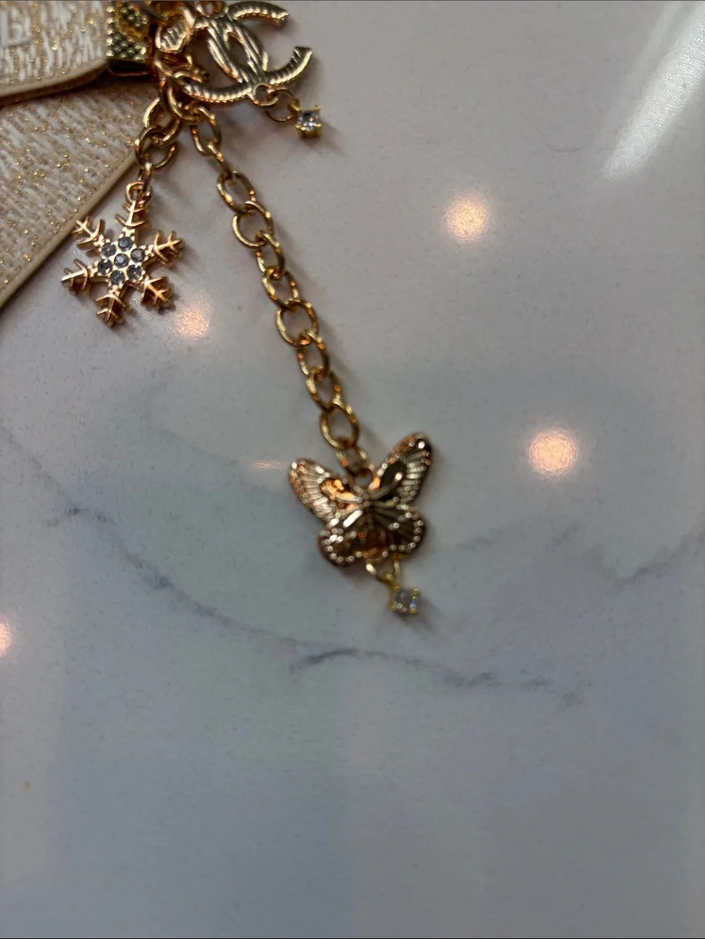 Beige and Gold Logo Strap Keychain with Charms